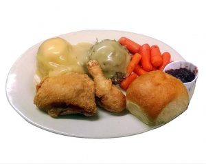 Broasted chicken with mashed potatoes, gravy, stuffing, carrots, cranberry and roll